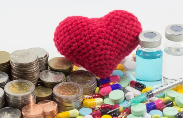 healthcare cost money coins and bills with medicine, vaccine and Farmácias